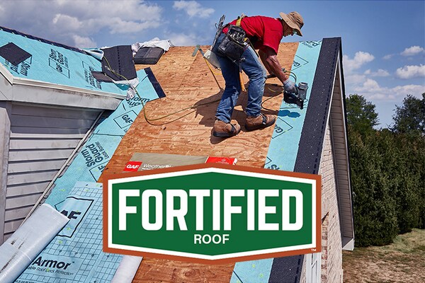 Roofer installing a GAF Fortified roof
